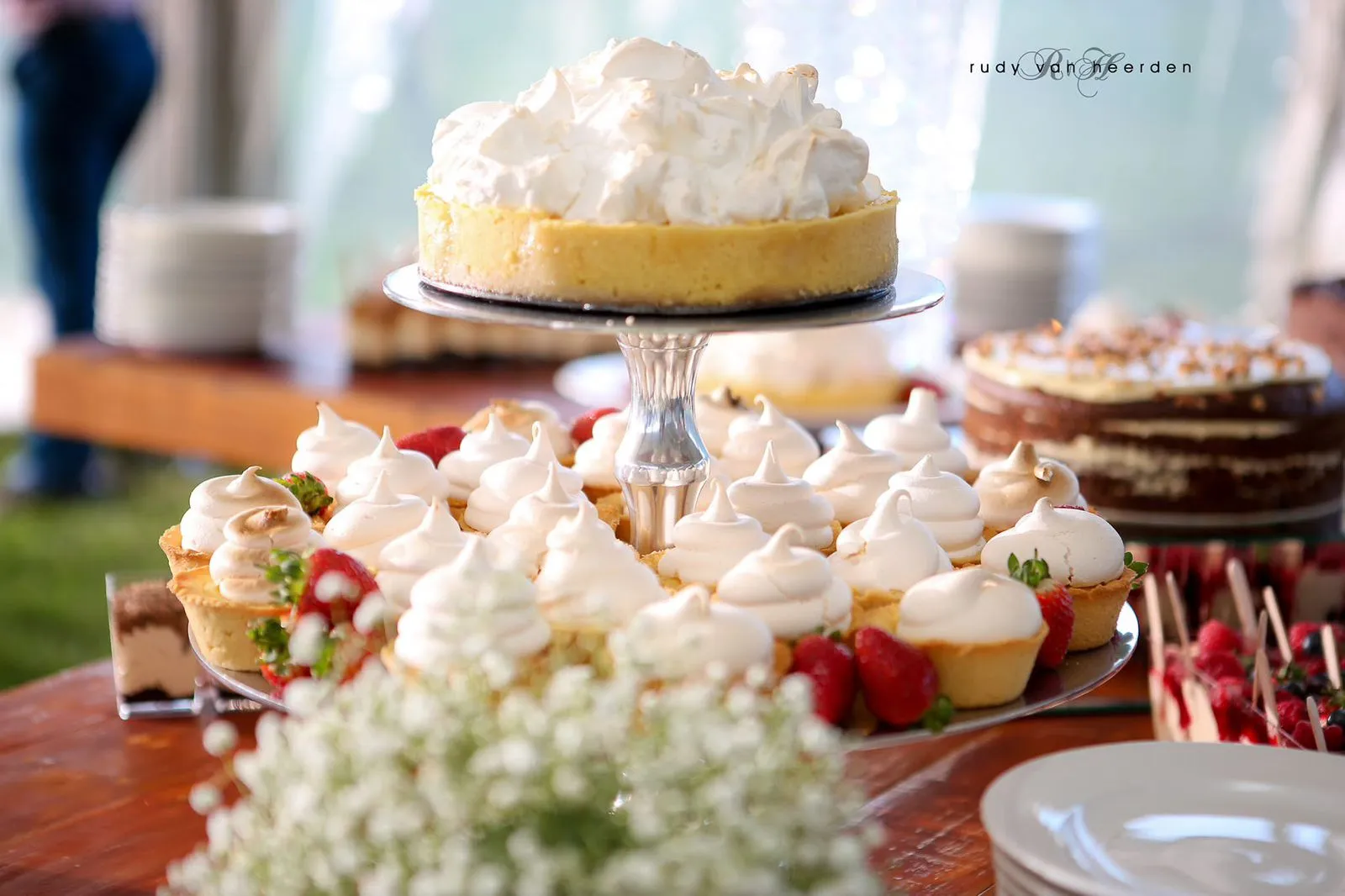 Wedding cake table with cupcakes